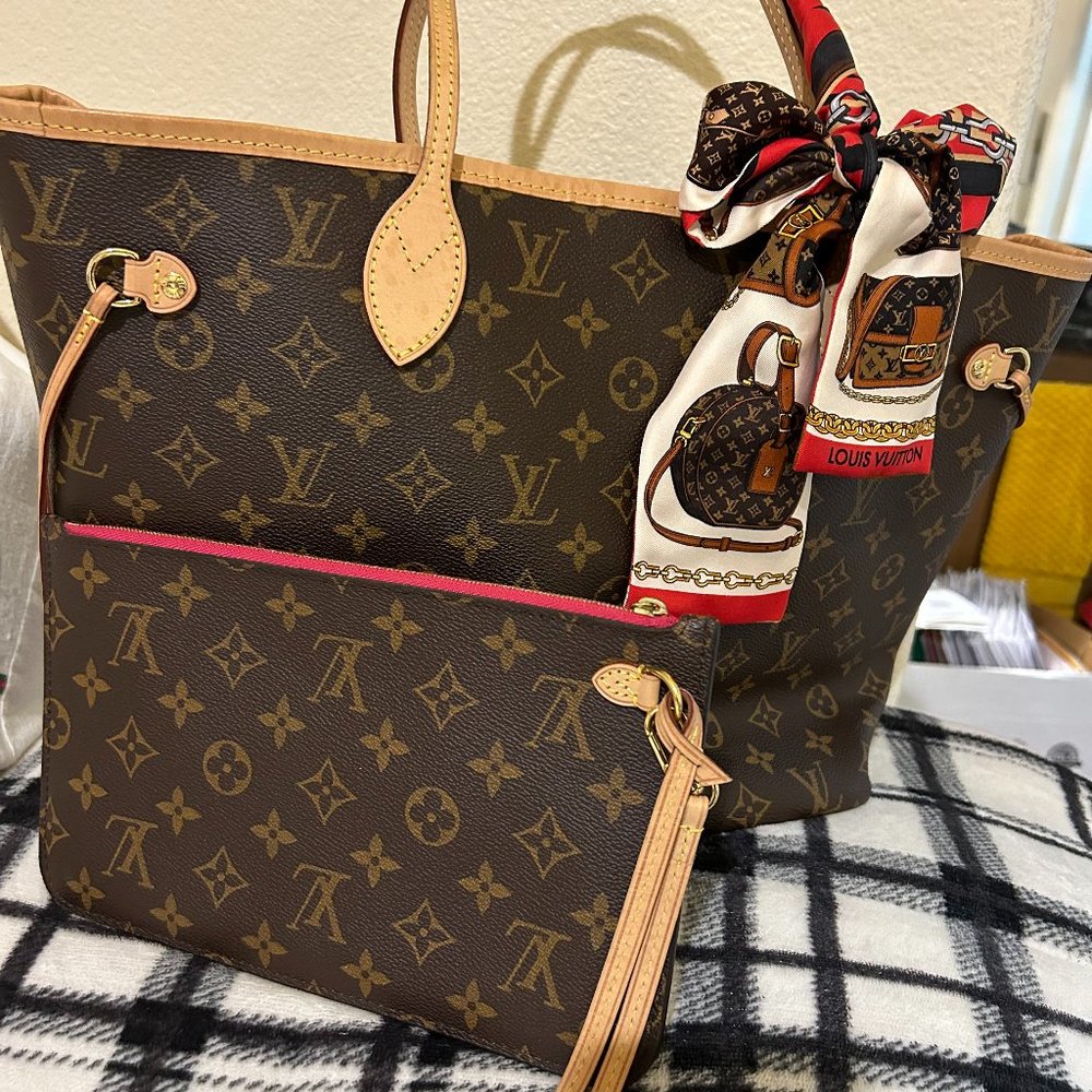 LOUIS VUITTON NEVERFULL MM tote unites timeless design with heritage details.